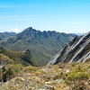 The Crags of Andromeda in the Western Arthur Range. This photo was taken from the Eastern Arthur Range not too far from Stuart Saddle. The sheets of rock on the right are known as The Boilerplates. The track threads its way through these plates.