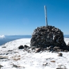 The cairn on the summit of Mt Bogong. A little bit of snow on the ground but a nice sunny day.